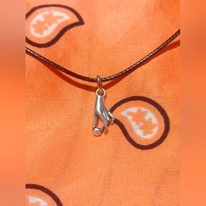 Black cord necklace with hand charm